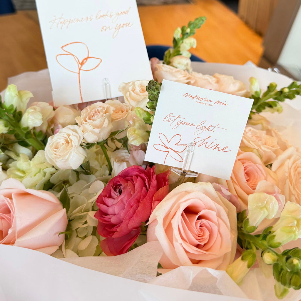 Pink roses and ranunculus bouquet with Mamma Mia gift cards in Miami