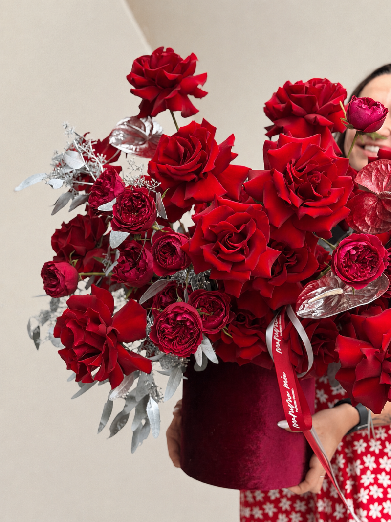 Red French roses arrangement with silver accents in a luxury flower box