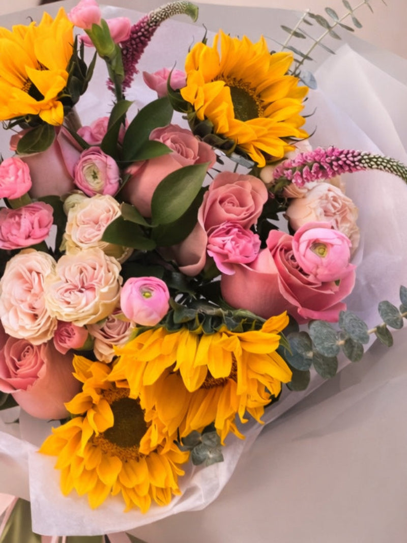 Luxury bouquet of yellow sunflowers and pink roses in Miami